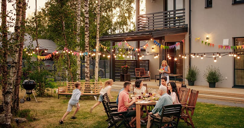 family enjoying a back yard i summer